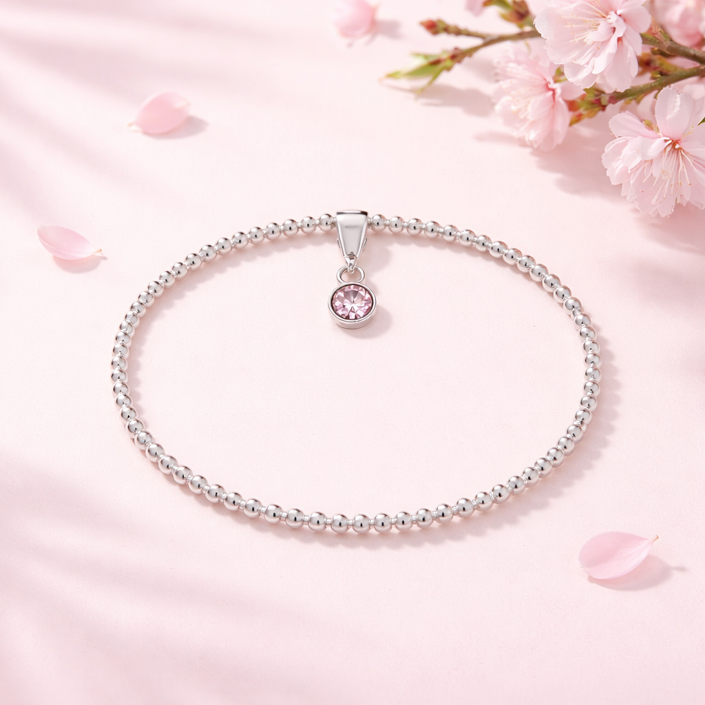 Sterling Silver Beaded bracelet with a pink birthstone charm