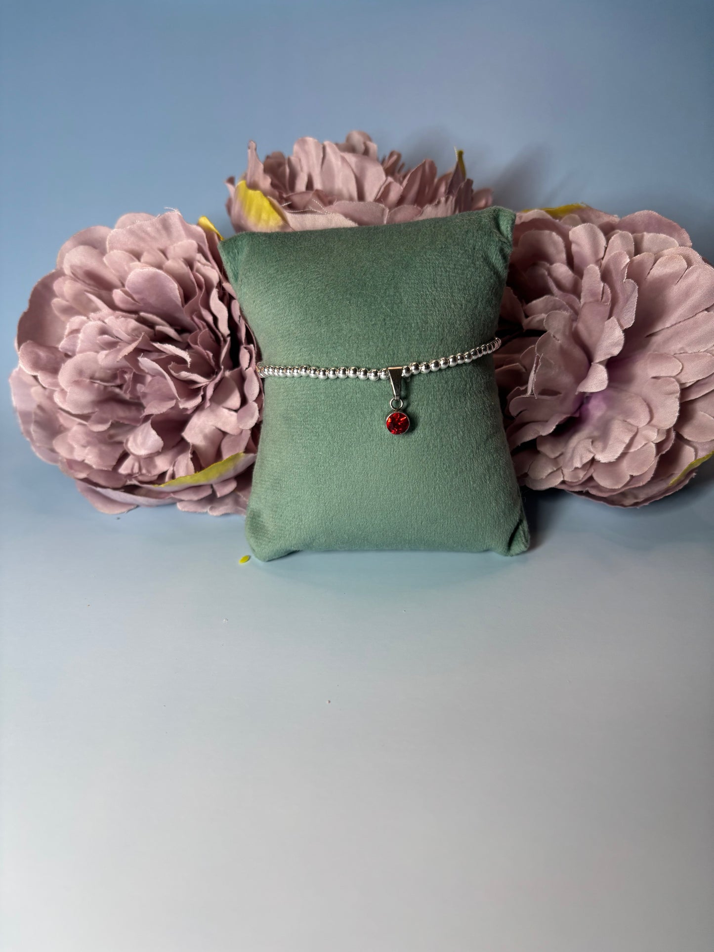 Sterling Silver Beaded bracelet with a 6mm garnet birthstone charm