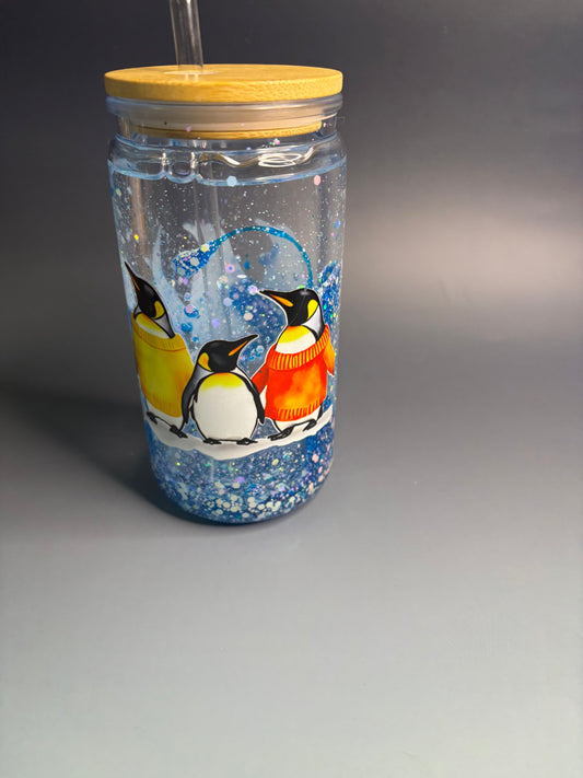 Snow globe tumbler with Penguin logo.