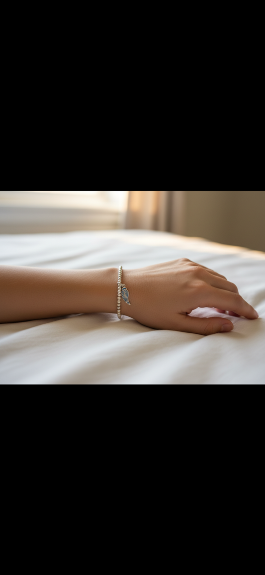 Sterling Silver Beaded bracelet with a large Angel Wing