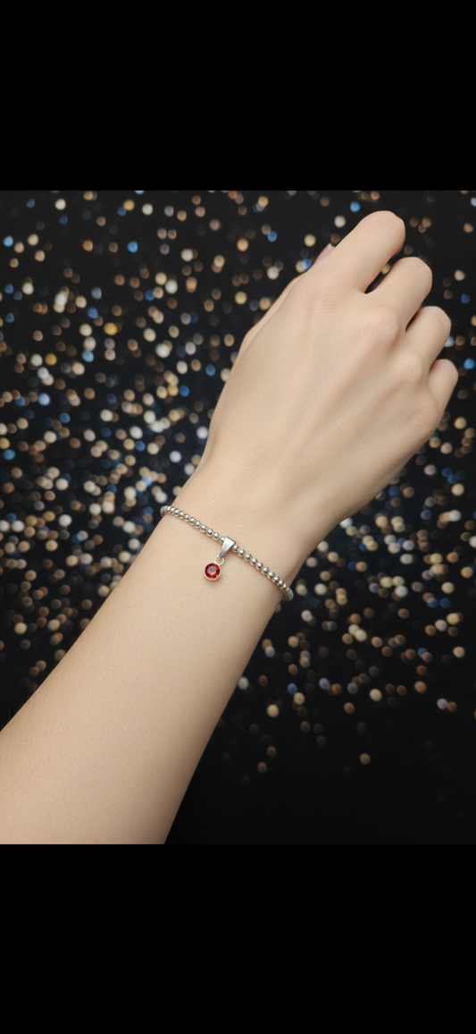 Sterling Silver Beaded bracelet with a 6mm garnet birthstone charm