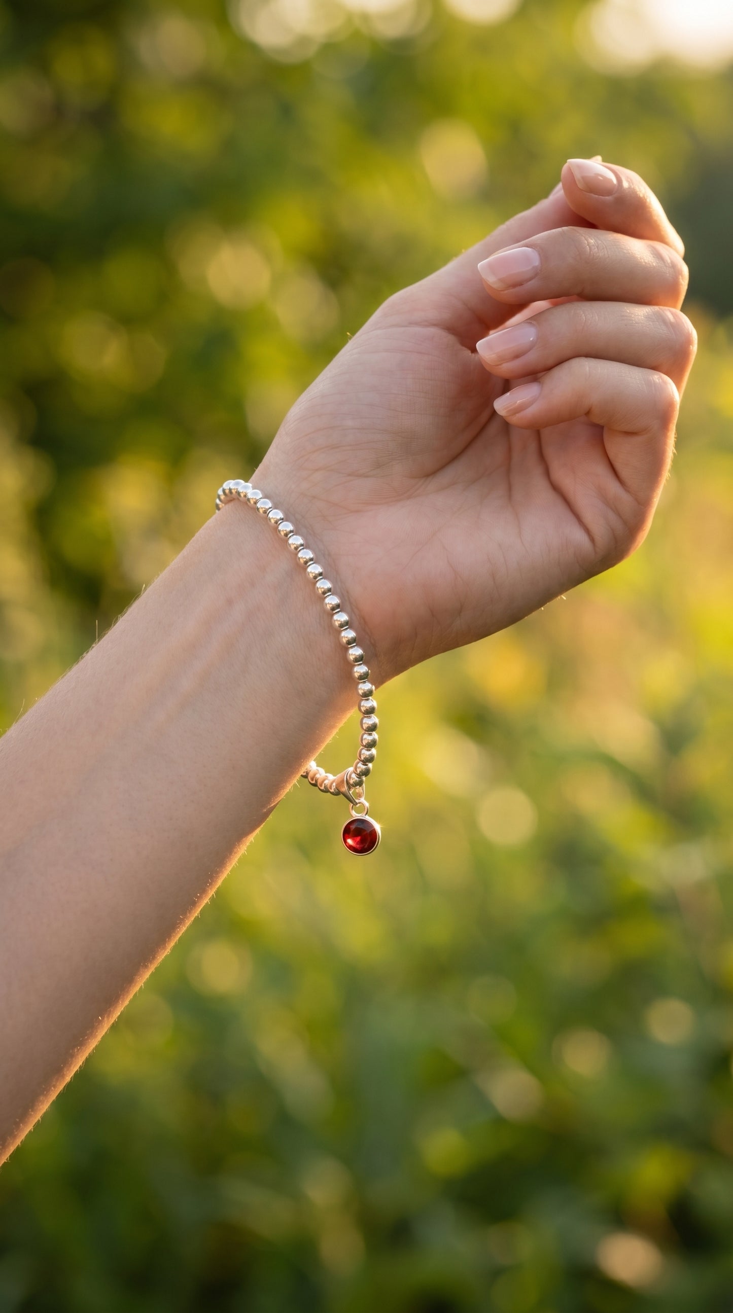 Sterling Silver Beaded bracelet with a 6mm garnet birthstone charm