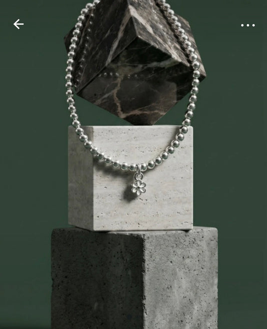 Sterling Silver Beaded bracelet with a flower charm