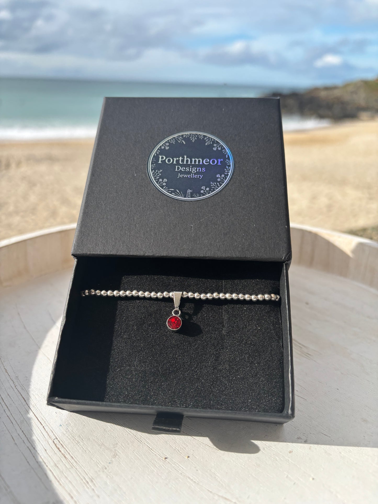 Sterling Silver Beaded bracelet with a 6mm garnet birthstone charm