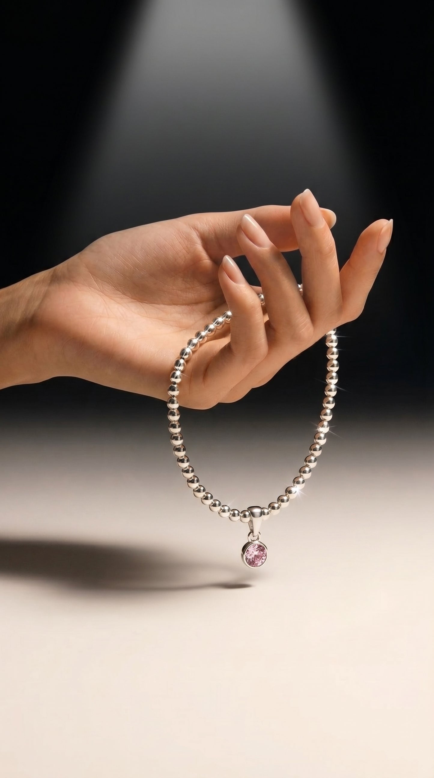 Sterling Silver Beaded bracelet with a pink birthstone charm